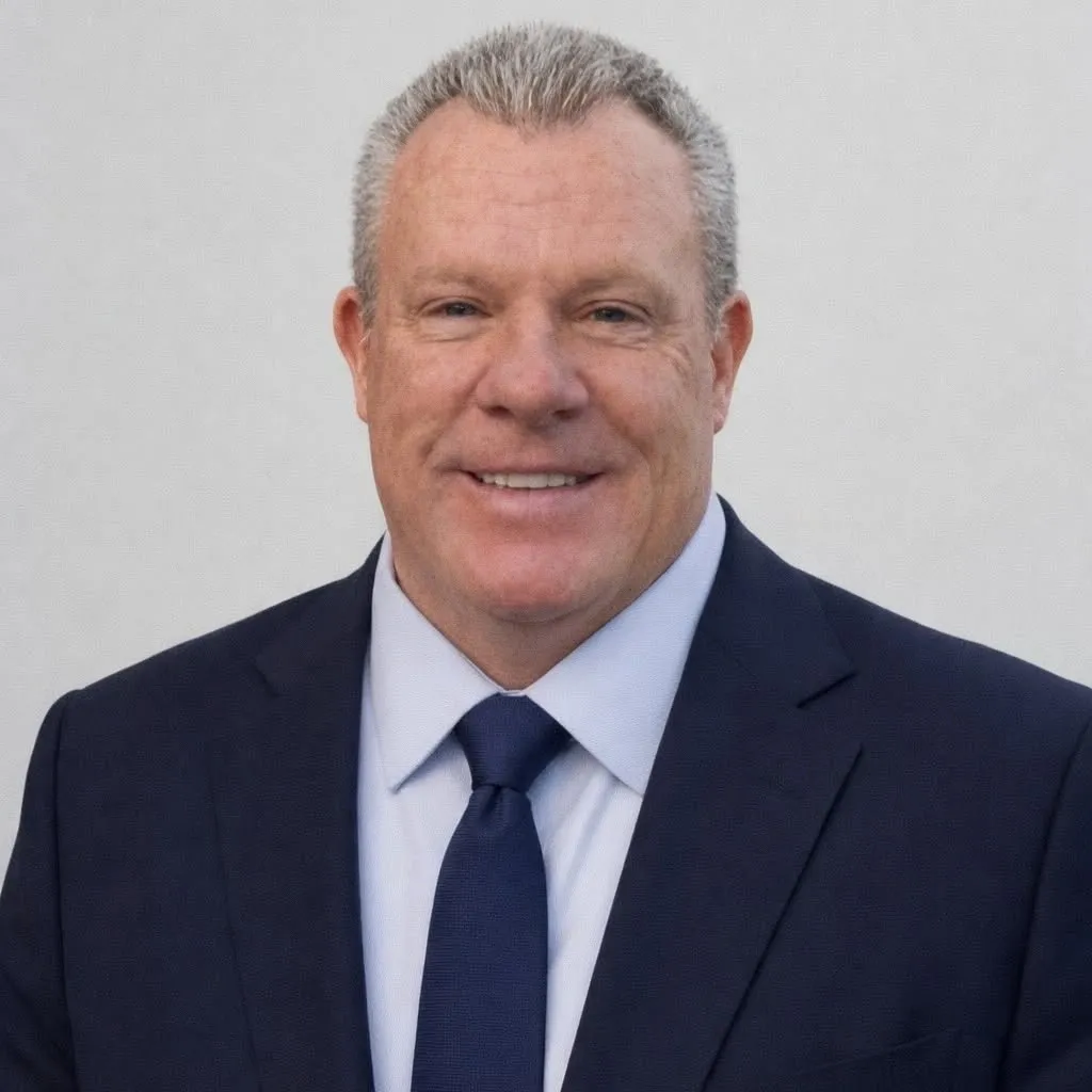Smiling businessman in navy suit and tie