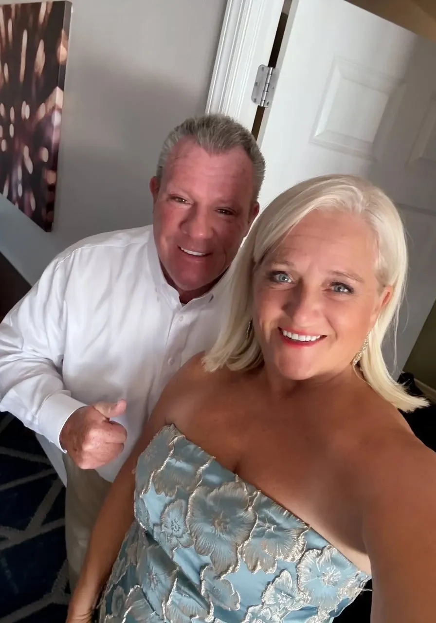 Smiling couple taking a selfie indoors