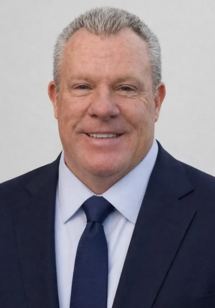 Smiling businessman in navy suit and tie