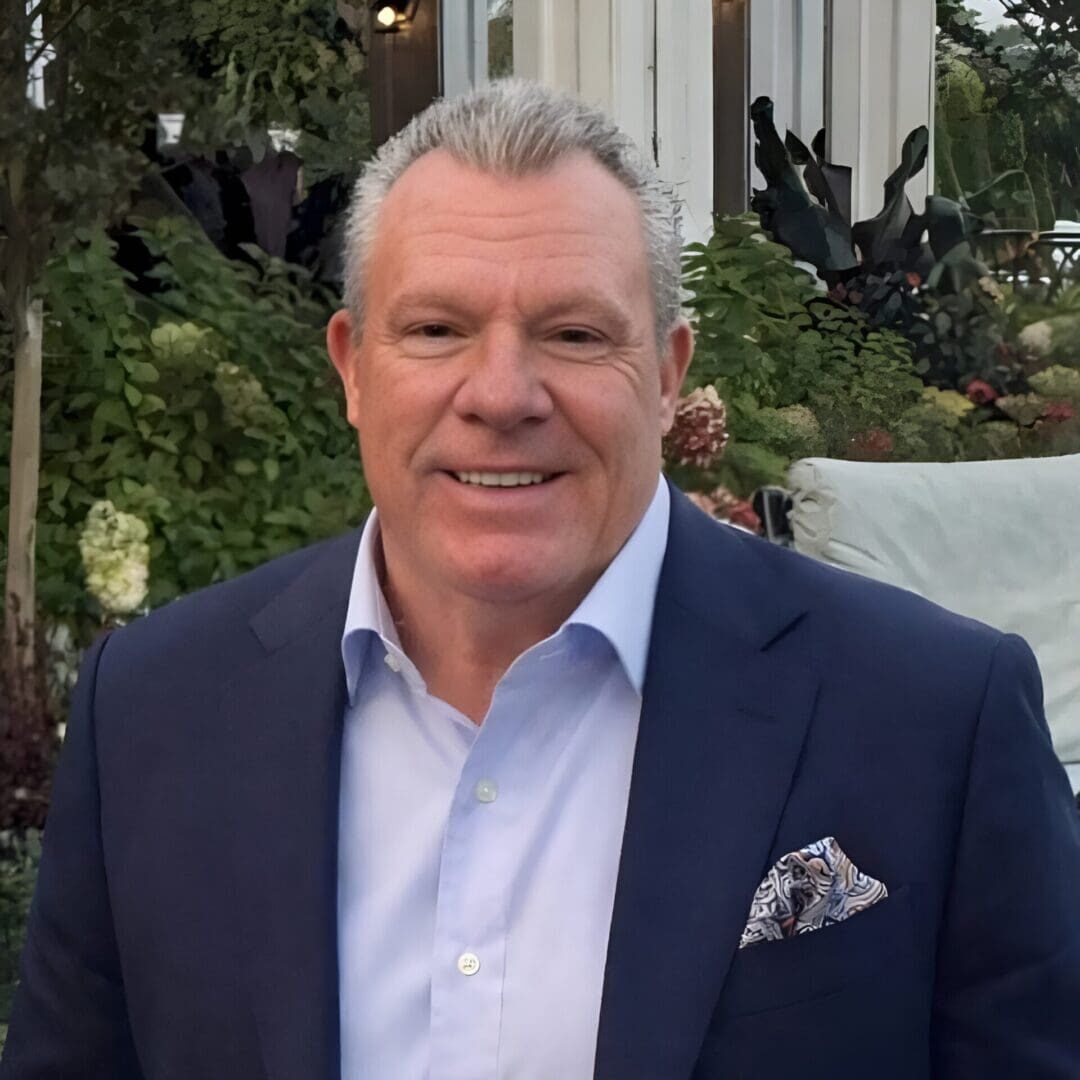 Smiling middle-aged man in navy suit